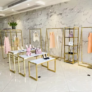 Modern Design Metal Side Shiny Gold Retail Garment Store Display Table Golden Clothing Display Racks for Clothes Shop Shelf